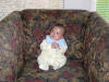 little child in big sofa